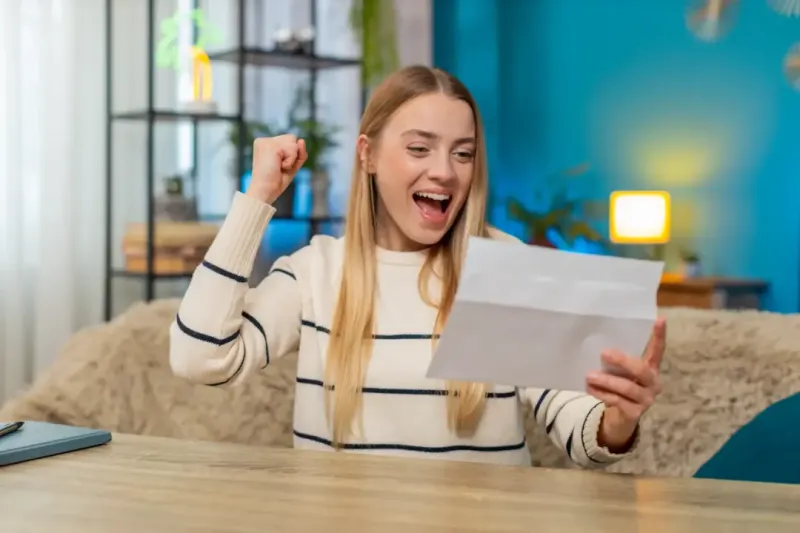 Woman looking at her lowered heating bills